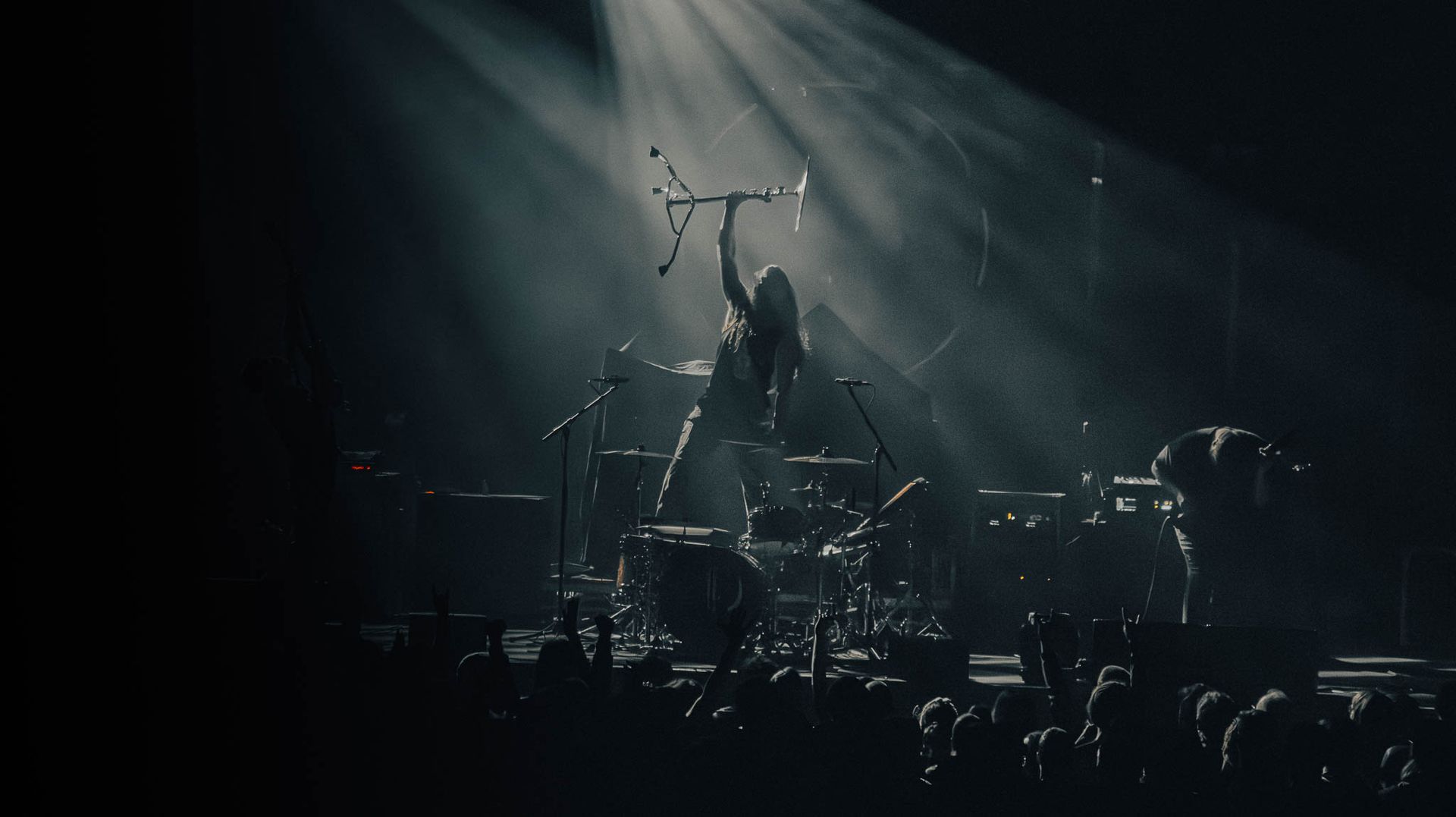 a concert viewing ending with the drummer holding a chair